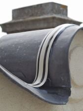 The Avishock system is extremely versatile. A strip of the Avishock system bending around a tight curve over the edge of a roof.
